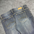 Sick 2000s low rise bootcut washed jeans, measures 35W x 30L