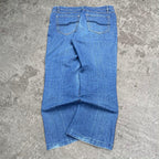 Cute 2000s bootcut low rise embroidered washed jeans, measures 34W x 35.5” outseam length