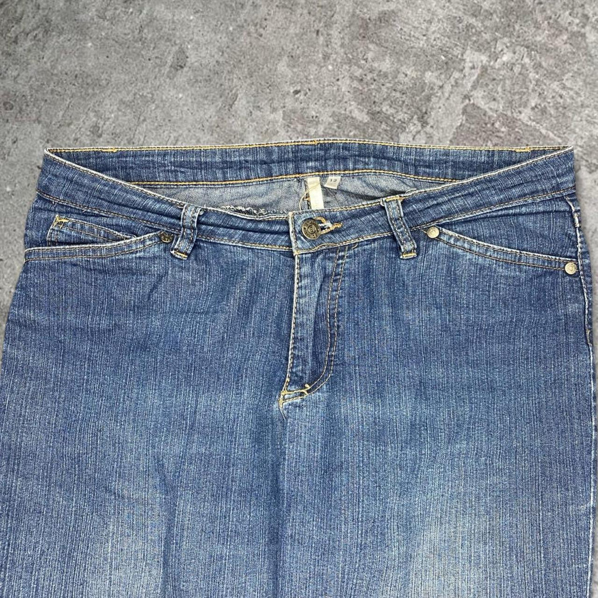 Cute 2000s bootcut low rise embroidered washed jeans, measures 34W x 35.5” outseam length